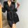 A woman elegantly poses with a rose, wearing a sleek black sleep dress made from lightweight ice silk fabric. the dress featu...
