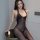 A woman poses elegantly wearing a qingyege sensual sheer mesh bodysuit with an open-crotch design, accentuated by lace detail...