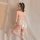 Woman in white lace bunny lingerie with open-crotch design, sheer stockings, and fluffy tail—seductive yet elegant.
