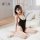 Woman wearing black suoqing ice silk swimsuit lingerie, a sexy 72d tight-fit cooling summer bodysuit, posing on bed.