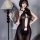 Sexy black lace bodysuit with cross-back design and open-crotch detail, featuring sheer fabric and elegant lace fan accessory...