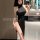 A woman poses in a sleek black nightgown with high slits, capturing her reflection in a bathroom mirror. the design features ...