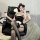 A stylish anime maid costume featuring a glossy black pvc bodysuit with lace details, perfect for roleplay enthusiasts seekin...