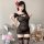 Woman wearing black see-through lace mesh bodycon mini dress with cutout corset detail and matching thigh-high stockings.