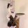 A blonde cosplayer wearing a black pvc bunny-themed lingerie set with lace-up details, holding a tray. perfect for anime cosp...