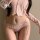 Elegant pink lace bikini featuring low-rise design, delicate bows, and sheer mesh fabric for a sweet and alluring look.