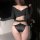 Sexy black silk lace panties featuring high slits and a cut-out cross detail on the top, offering a pure and tempting look wi...