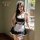 Woman modeling black and white french maid lingerie set with lace trim, apron, headpiece, and choker by window.
