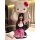 A woman wearing an adorable kitty cat maid costume set, featuring a cute dress with a large hello kitty head prop, perfect fo...