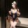 Woman modeling navy blue bodysuit with white trim, open crotch design, and matching accessories for roleplay.