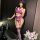 Woman modeling purple ai ru ru lingerie set with lace bodysuit, garter belt, and thigh-high stockings in elegant room setting...