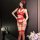 Woman wearing red lace ai ru ru lingerie set with garter belt, thigh-high stockings, and rose hair accessory in elegant room ...
