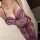 Woman wearing purple lace see-through lingerie set, ai ru ru sexy nightclub outfit, erotic design with floral details.