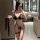 Woman modeling black ai ru ru sexy lingerie set with bondage-style straps and garter in modern bathroom mirror selfie.