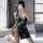 A stylish vintage-inspired dress featuring a high-waist design, elegant pearl embellishments, and a deep v-neckline, perfect ...