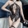 Woman wearing black airusu sexy lace bodysuit with deep v-neck, backless mesh design and strappy camisole style lingerie.