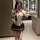 A woman poses in a mirror wearing an airusu sexy student uniform lingerie set, featuring a plunging white blouse with a tie a...