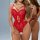Woman wearing red lace bodysuit with sheer panels and strappy design, perfect for nightclub or stage lingerie looks.