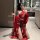 A woman poses in an elegant bathroom wearing a red ancient chinese court-style lingerie set, featuring a sensual hanfu doudou...