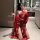 A woman poses in an elegant bathroom wearing a red ancient chinese court-style lingerie set featuring a sensual hanfu bodice ...