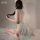 A woman poses in an elegant ancient chinese style silk belly band bodysuit, featuring sheer fabric and delicate design detail...