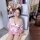 A woman poses beside an open refrigerator wearing a pink anime-inspired sexy deep v kimono lingerie set, featuring japanese s...