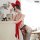 Woman wearing red bare-back lace bodysuit with neck tie and giant bow, sheer mesh thong set, erotic lingerie for women.