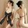 Woman modeling black bare-back lace bodysuit with neck tie and giant bow front, sheer mesh thong set lingerie.