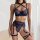Woman wearing navy blue lace lingerie set with beanie-trimmed jk-style bra, garter belt, and thigh straps for playful eleganc...