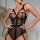 Sexy black bodysuit featuring sheer mesh design, lace-up detail, and push-up effect for a stylish look.
