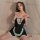 A woman poses wearing a black deep v sexy mini skirt lingerie set with lace details, perfect for seductive nightwear.