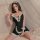 A woman poses in a black deep v sexy mini skirt lingerie set, featuring lace details and delicate straps, perfect for seducti...