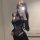 Woman wearing black lace lingerie set with padded cups, open-crotch design, and sheer long sleeves in mirror selfie.