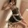 Woman wearing black maid costume with sheer mesh skirt, lace trim, and white apron - sexy lingerie role play outfit.