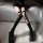 Black over-the-knee fishnet stockings featuring lace-up thigh highs with bow accents, perfect for a sweet yet edgy look.
