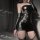 Sexy black patent leather corset dress with open back and sleeve details, perfect for nightclub and party outfits.