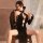 A woman poses elegantly in a black velvet lace-up cheongsam sleepwear set, featuring sexy retro design elements and split sle...