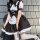 A woman wearing a black and white gothic lolita maid dress with ruffles, corset, and bow tie, perfect for halloween costumes.