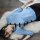 A woman lies on a white rug wearing a blue lace cheongsam lingerie set, featuring sheer silk blend with vintage chinese-inspi...