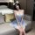 A woman wearing a blue maid costume, featuring a plaid dress with lace details and a flirty petticoat, perfect for role play ...