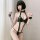 Woman in black lace bodysuit with chain details, strapless design, and wrist cuffs for nightclub or roleplay.