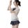 Woman modeling sheer white jk uniform top with bow and pleated plaid skirt from british-style lace teddy set.