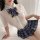 Sexy schoolgirl style sheer blouse with plaid bow tie and pleated skirt, perfect for bold fashion statements.