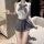 Woman wearing a white sleeveless bodysuit with a grey bow tie and matching pleated skirt, styled as a cute college jk uniform...