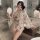 Woman wearing butterfly print sheer deep v kimono robe set in bathroom, holding decorative fan, elegant lingerie sleepwear.
