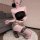 Woman kneeling in black strapless top and leopard print cut-out bodysuit with matching garter belt, sheer stockings.