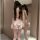 Woman wearing butterfly rain sexy bunny costume with sheer top, open-crotch shorts, bunny ears, and thigh-high stockings.