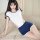 A woman poses wearing a campus-themed sexy sleepwear set featuring a cute and spicy design. the short-sleeve tie-front bodysu...