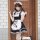 A stylish model poses in a classic black and white maid costume, featuring playful cat paw designs on the apron, perfect for ...