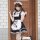 A stylish model poses in a classic black and white maid costume, featuring a ruffled apron with paw prints, perfect for cospl...